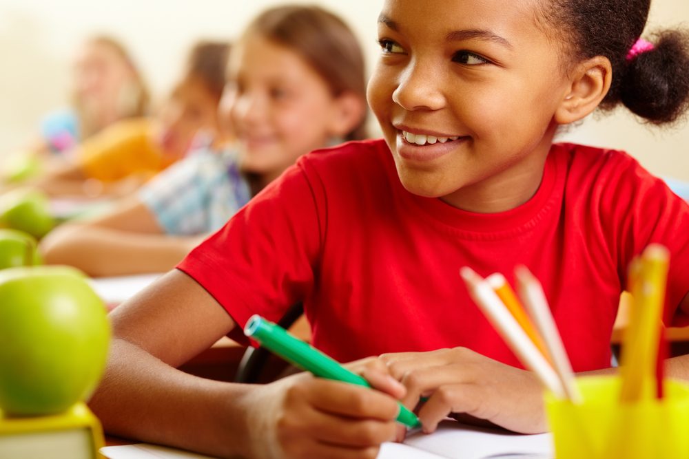 Row,Of,Pupils,Looking,At,Teacher,With,Cute,Girl,In